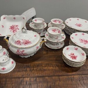 Vintage Bavaria porcelain dinnerware set With a gold rim and a floral pattern